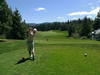 Golfer mid-swing